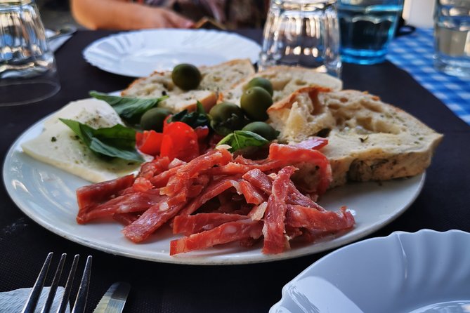Authentic Pizza Making Class in Naples with Appetizers and Drink - Stretching, topping, and baking your pizza