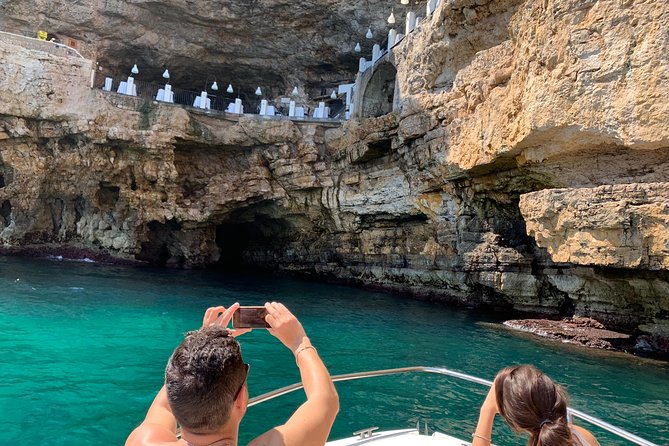Boat tour of the Polignano a Mare caves with aperitif - Starting at Abbazia di San Vito