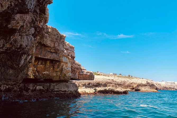Boat tour of the Polignano a Mare caves with aperitif - Grotta Azzurra beneath Santo Stefano