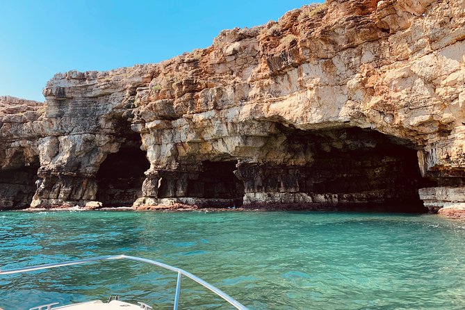Boat tour of the Polignano a Mare caves with aperitif - Grotta Palazzese and its famous restaurant