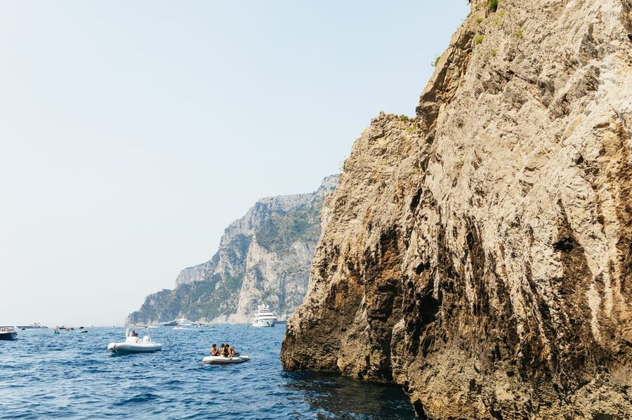 Capri: Island Boat Tour and Optional Blue Grotto Visit - Tiberius’s Leap and the story behind the cliff