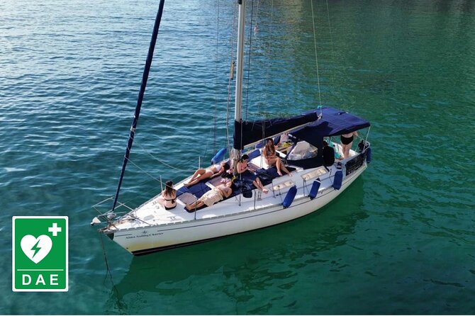 Catamaran tour stops bathing and snorkeling toast with prosecco - Cala Mosca and the white limestone coast
