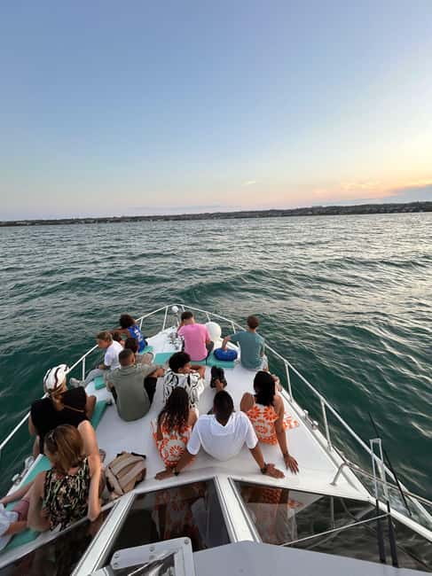 Desenzano del Garda: Sunset Boat Trip at Sunset with Drink - The view of Sirmione from the lake