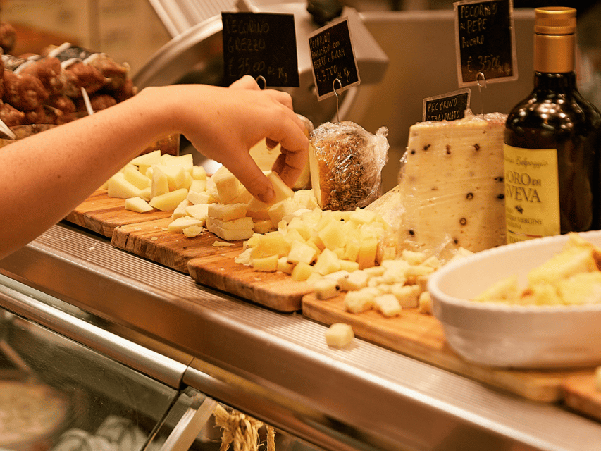 Florence: Cooking Class with Local Food Market Tour - Sitting down to a Tuscan meal