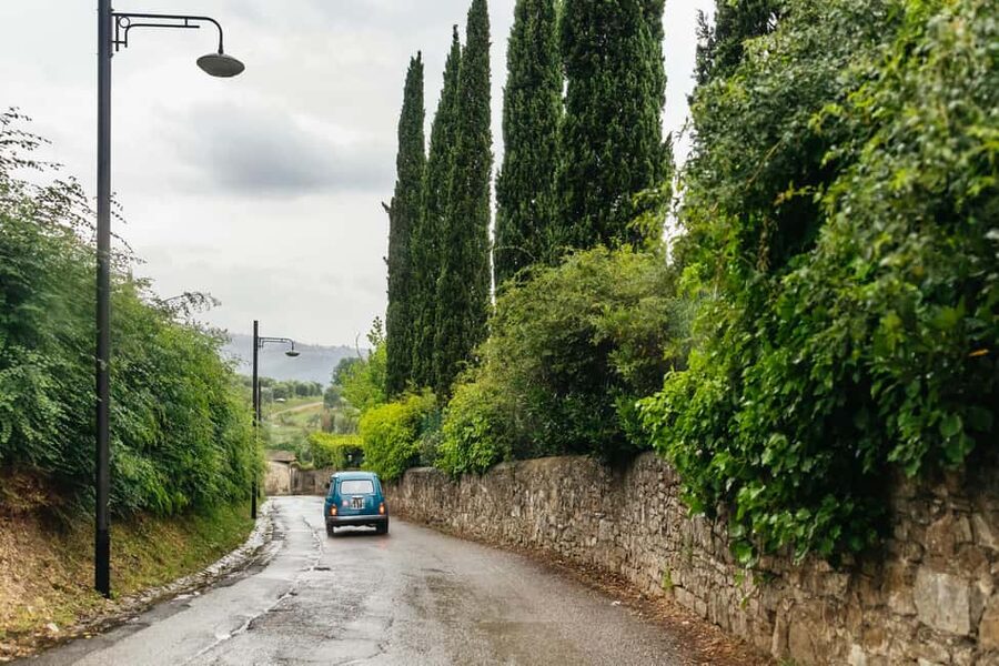 Florence: Countryside Vintage Fiat 500 Driving Tour - A Tuscan terrace with food and Chianti