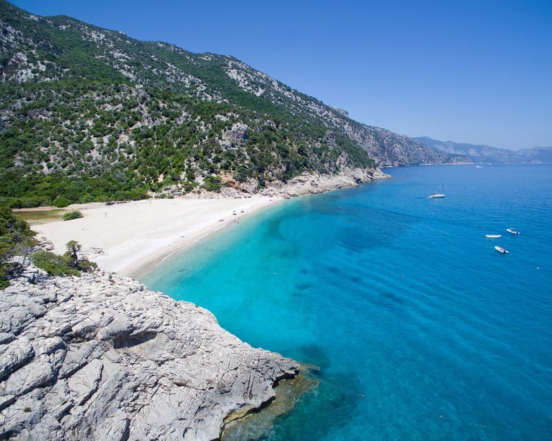 From Arbatax: Full-Day Guided Boat Tour of the Baunei Coast - Grotta del Fico and the story beneath the cliffs