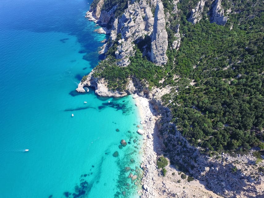 From Arbatax: Full-Day Guided Boat Tour of the Baunei Coast - Boarding the Falco della Regina in Arbatax