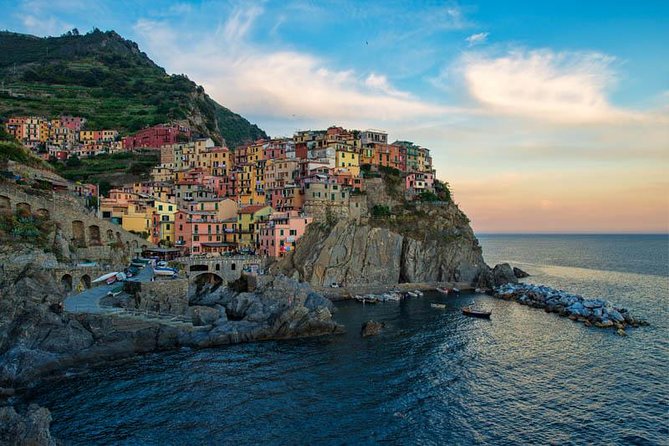 From Milan: Cinque Terre Guided Full-Day Trip With Cruise - Manarola: harbour rocks, cafés, and quick coastal views