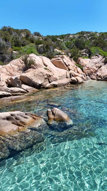 From San Teodoro: Tavolara Archipelago Grand Tour - Tavolara’s cliffs and the long island break