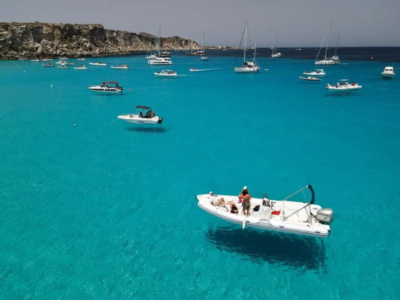 From Trapani: Egadi Islands Favignana & Levanzo Cruise - Music, drinks, and the social mood