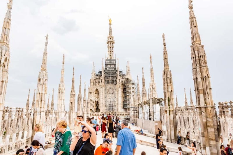 Milan Duomo Rooftops Tour + Optional Hop-on-Hop-off ticket - Walking above Milan’s famous cathedral