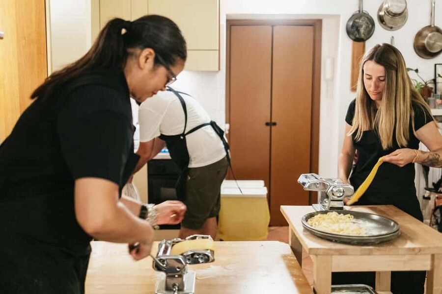 Milan: Pasta & Tiramisu Cooking Class with Premium Products - Sitting down to eat what you made