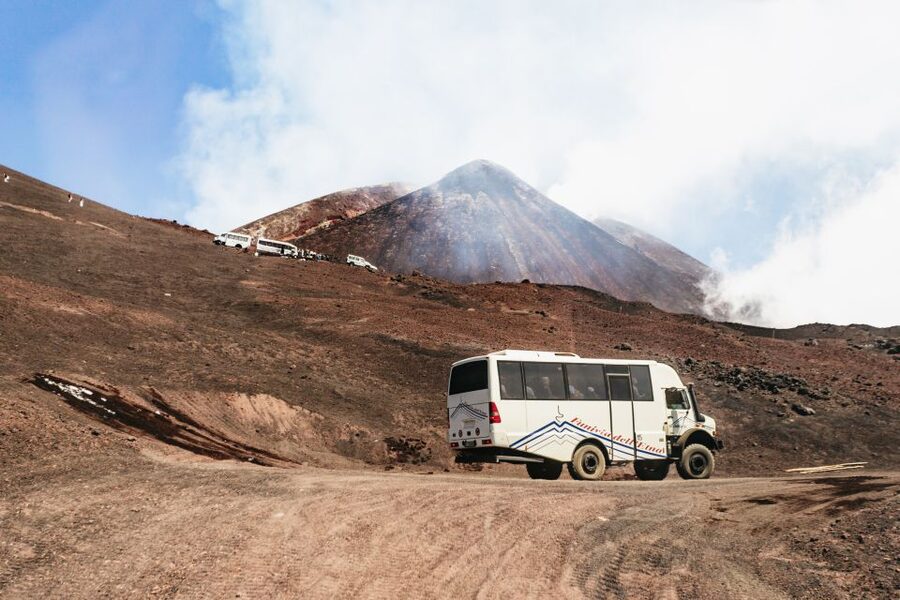 Mount Etna: Summit Trek with Cable Car and snack included - Descending across recent eruption craters