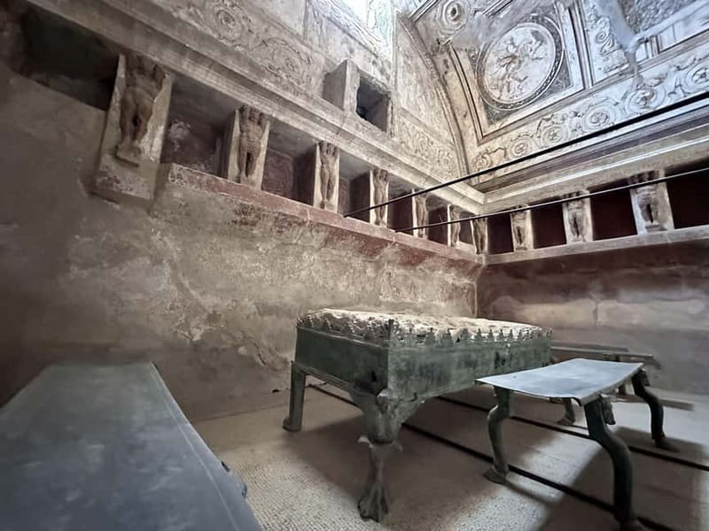 Pompeii: Exclusive Tour with Archaeologist and Entry Tickets - Baths, market, and the human cost of the eruption