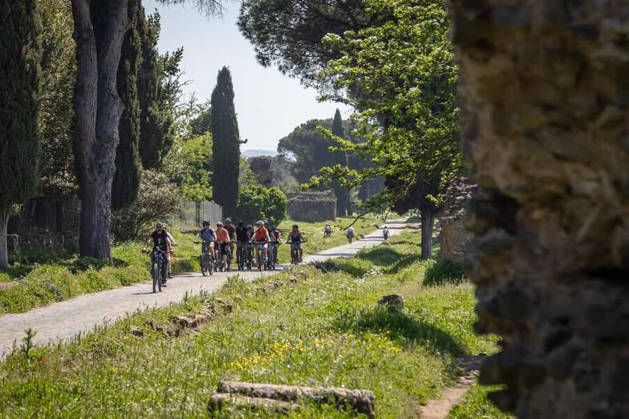 Rome:Appian Way E-bike Tour with Catacombs, Aqueducts & Food - Entering the catacombs beneath Rome