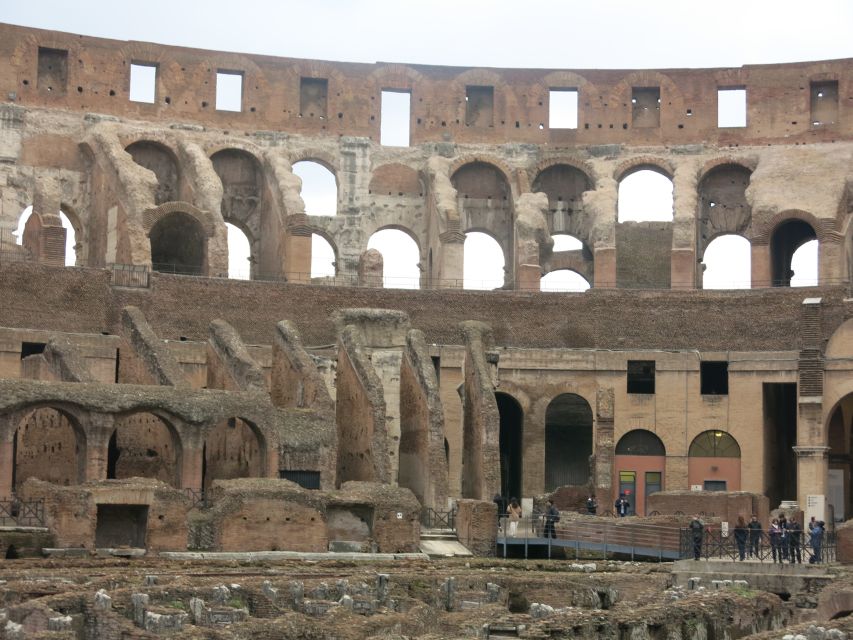 Rome: Colosseum Arena Floor, Roman Forum & Palatine Tour - Walking through the Roman Forum
