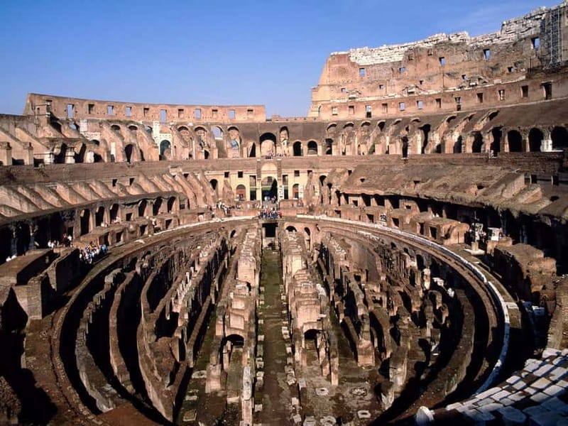 Rome: Colosseum & Forum Small Group Tour with Palatine Hill - Entering the Colosseum and seeing the first two tiers