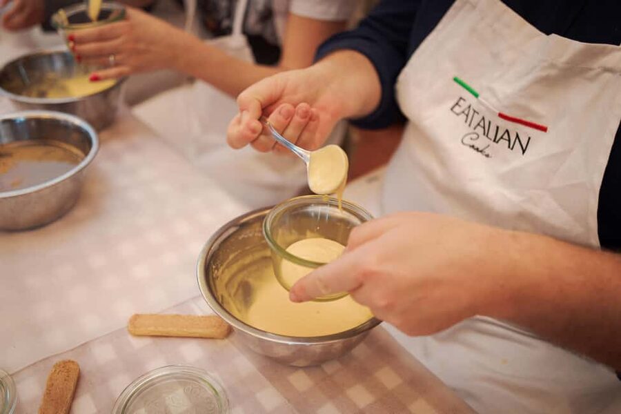 Rome: Pizza and Tiramisu Cooking Class in Piazza Navona - Sitting down to eat your own work