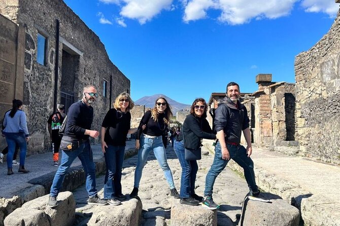 Rome to Pompeii Guided Tour with Wine & Lunch by High Speed Train - Meeting your Naples guide and crossing to Vesuvius