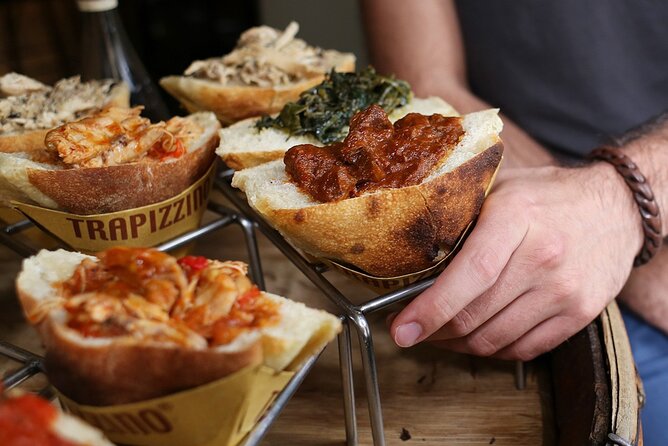 Rome: Trastevere Food tour with Free-Flowing Fine Wine - Crostini, cheese, and charcuterie at the wine stop