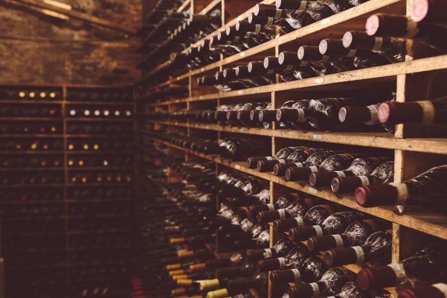 Rome: Twilight Trastevere Food Tour with Wine Tasting - Wine in a cellar older than the Colosseum
