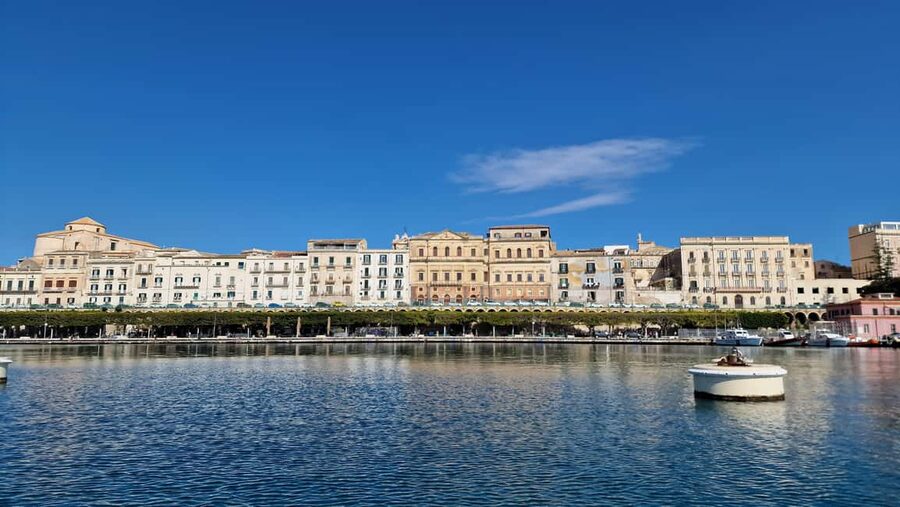 Siracusa: Ortigia & Sea Caves Speedboat Tour with Swim Stop - Music, stories, and the mood on board