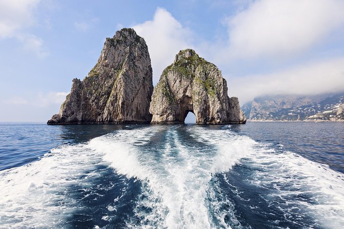 Small Group Capri Island Boat Ride with Swimming and Limoncello - Finding the white umbrellas at Marina Grande