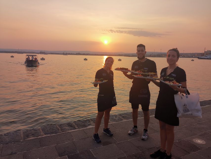 Syracuse: Ortigia Sunset Cruise with Aperitif - Sunset, music, and the final pass under the bridge