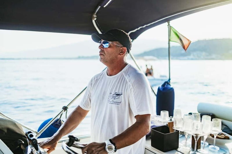 Taormina: Sunset Boat Tour with Dolphin Watching & Aperitif - Isola Bella and the swimming stop